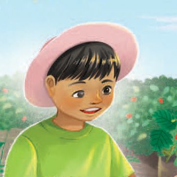 A smiling child wearing a pink hat and green shirt stands outdoors, with green plants and small red flowers visible in the background under a blue sky.